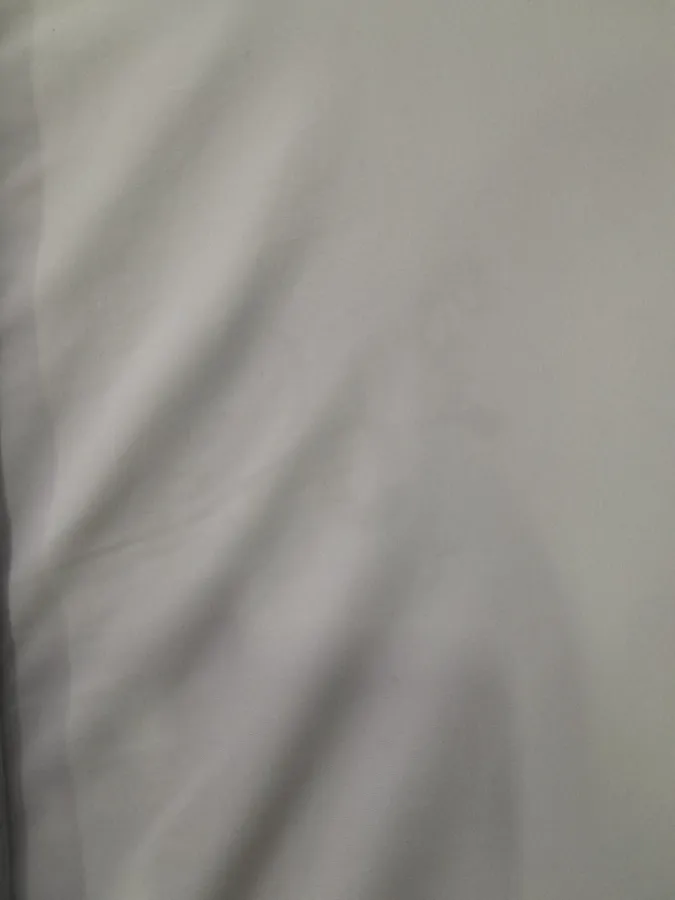 Tecido do colchão com pequena mancha Tecido do colchão com pequena mancha